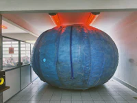 a large blue ball in a hallway